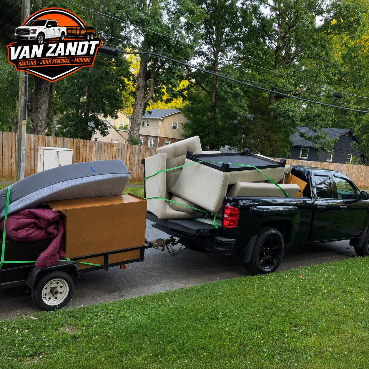 Truck bed and trailer loaded with a couch, mattress, and furniture for junk removal